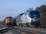 AMTK 97, UP 8099  14Feb2010  NB Train 22 (Texas Eagle) in CENTEX passes UP 8099 waiting on the side in CENTEX with MOW 